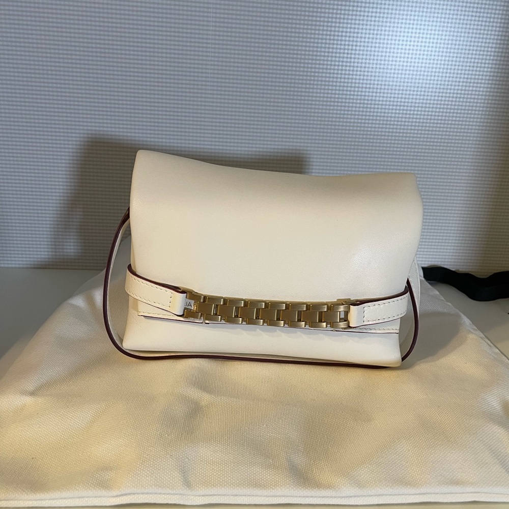 Chic White Leather Clutch with Gold Chain Detail
